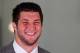 FLORHAM PARK, NJ - MARCH 26: Quarterback Tim Tebow addresses the media as he is introduced as a New York Jet at the Atlantic Health Jets Training Center on March 26, 2012 in Florham Park, New Jersey. Tebow, traded from the Denver Broncos last week, will be the team's backup quarterback according to Jets head coach Rex Ryan. Tebow, the 2007 Heisman Trophy winner, started 11 games in 2011 for Denver and finished with a 7-4 record as a starter. He led the Broncos to a playoff overtime win against the Pittsburgh Steelers in the first round before eventually losing to the New England Patriots in the next round. (Photo by Jeff Zelevansky/Getty Images)