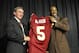 Donovan McNabb stands with head coach Mike Shanahan after signing with the Washington Redskins in April of 2010