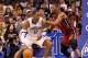ORLANDO, FL - MARCH 13: Dwight Howard #12 of the Orlando Magic is guarded by Chris Bosh #1 of the Miami Heat during the game at Amway Center on March 13, 2012 in Orlando, Florida. NOTE TO USER: User expressly acknowledges and agrees that, by downloading and or using this photograph, User is consenting to the terms and conditions of the Getty Images License Agreement. (Photo by Sam Greenwood/Getty Images)