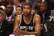 PHOENIX, AZ - MARCH 27: Tim Duncan #21 of the San Antonio Spurs sits on the bench during the NBA game against the Phoenix Suns at US Airways Center on March 27, 2012 in Phoenix, Arizona. The Spurs defeated the Suns 107-100. NOTE TO USER: User expressly acknowledges and agrees that, by downloading and or using this photograph, User is consenting to the terms and conditions of the Getty Images License Agreement. (Photo by Christian Petersen/Getty Images)
