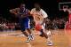 NEW YORK - NOVEMBER 15: Elijah Johnson #15 of the Kansas Jayhawks drives the ball against Darius Miller #1 of the Kentuky Wildcats during the 2011 State Farms Champions Classic at Madison Square Garden on November 15, 2011 in New York City. (Photo by Chris Trotman/Getty Images)