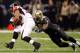 NEW ORLEANS, LA - DECEMBER 26: Running back Michael Turner #33 of the Atlanta Falcons runs the ball against outside linebacker Jo-Lonn Dunbar #56 of the New Orleans Saints in the first half at the Mercedes-Benz Superdome on December 26, 2011 in New Orleans, Louisiana. (Photo by Chris Graythen/Getty Images)