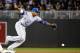 MINNEAPOLIS, MN - SEPTEMBER 28: A throw from Bruce Chen #52 of the Kansas City Royals gets past Alcides Escobar #2 in the fourth inning on September 28, 2011 at Target Field in Minneapolis, Minnesota. (Photo by Hannah Foslien/Getty Images)