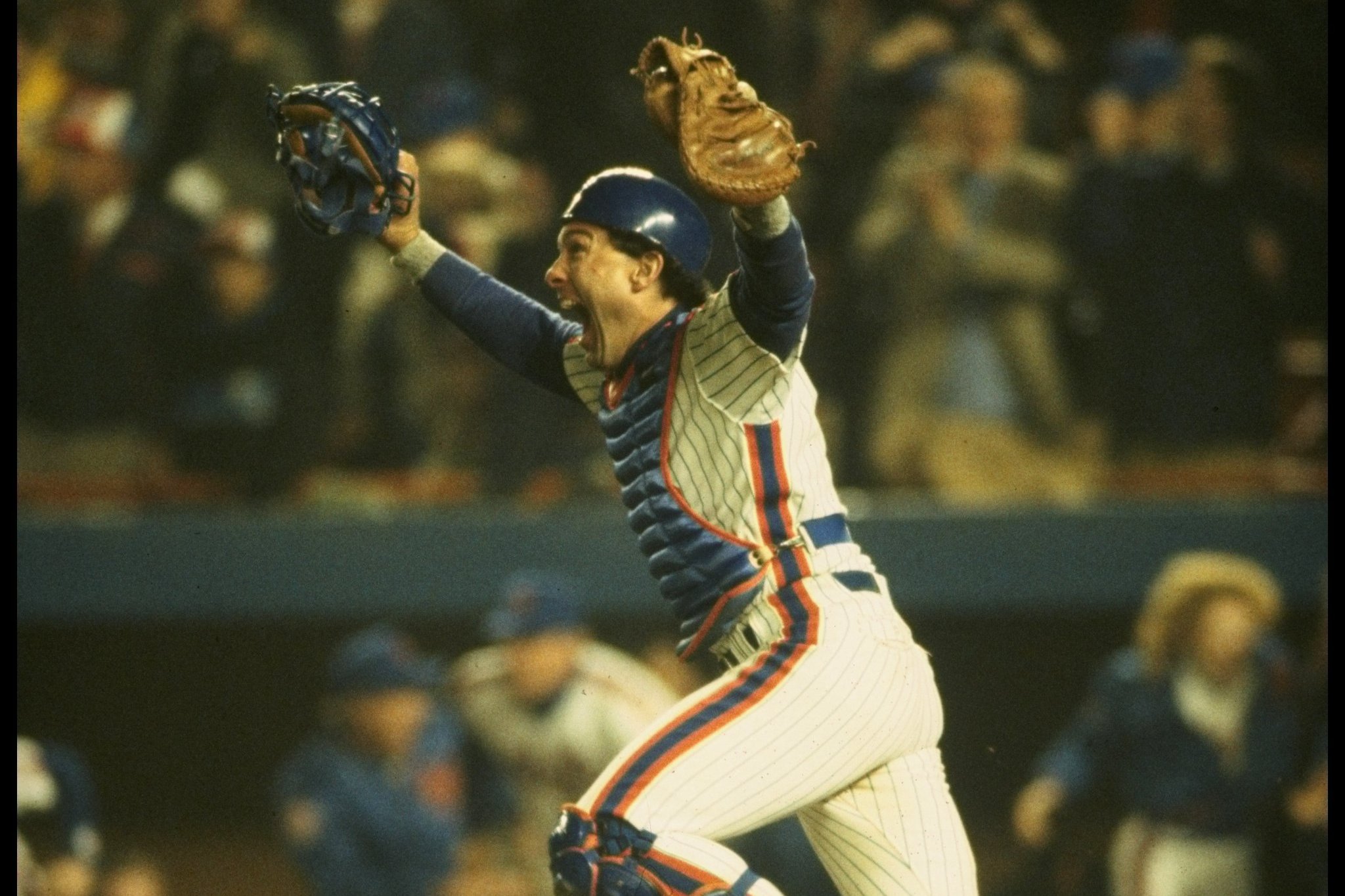 Family members of Hall of Fame Mets player Gary Carter throw out the first  pitch before the New York Mets play the Atlanta Braves on Opening Day at  Citi Field in New