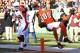 CINCINNATI, OH - DECEMBER 24: Jerome Simpson #89 of the Cincinnati Bengals jumps over Daryl Washington #58 of the Arizona Cardinals for a 19-yard touchdown during first half action at Paul Brown Stadium on December 24, 2011 in Cincinnati, Ohio. (Photo by Joe Robbins/Getty Images)