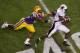 BATON ROUGE, LA - NOVEMBER 13: Jyruss Edwards #7 of the University of Louisiana-Monroe Warhawks avoids a tackle by Kevin Minter #46 of the Louisiana State University Tigers at Tiger Stadium on November 13, 2010 in Baton Rouge, Louisiana. The Tigers defeated the Warhawks 51-0. (Photo by Chris Graythen/Getty Images)