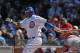CHICAGO, IL - APRIL 05: Marlon Byrd #24 of the Chicago Cubs hits a run-scoring single in the 4th inning against the Washington Nationals during the opening day game at Wrigley Field on April 5, 2012 in Chicago, Illinois. (Photo by Jonathan Daniel/Getty Images)