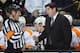 BOSTON, MA - JANUARY 13: Head coach Peter Laviolette of the Philadelphia Flyers talks with referee Brad Watson before the start of the second period against the Boston Bruins on January 11, 2011 at the TD Garden in Boston, Massachusetts. (Photo by Elsa/Getty Images)