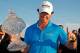 PALM BEACH GARDENS, FL - MARCH 04: Rory McIlroy of Northern Ireland poses with the trophy after winning the Honda Classic at PGA National on March 4, 2012 in Palm Beach Gardens, Florida. (Photo by Mike Ehrmann/Getty Images)