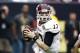 HOUSTON - DECEMBER 31: Quarterback Ryan Tannehill #17 of Texas A&M Aggies rolls out looking for a receiver against Northwestern Wildcats at Reliant Stadium on December 31, 2011 in Houston, Texas. (Photo by Bob Levey/Getty Images)