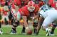 TAMPA, FL - JANUARY 02: Center Ben Jones #60 sets to snap the ball to quarterback Aaron Murray #11 of the Georgia Bulldogs during play against the Michigan State Spartans in the Outback Bowl January 2, 2012 at Raymond James Stadium in Tampa, Florida. (Photo by Al Messerschmidt/Getty Images)