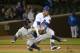 CHICAGO, IL - APRIL 9: Third baseman Ian Stewart #2 of the Chicago Cubs tags out Nyjer Morgan #2 of the Milwaukee Brewers after Morgan was caught in a rundown on a pickoff move during the seventh inning at Wrigley Field on April 9, 2012 in Chicago, Illinois. (Photo by Brian Kersey/Getty Images)