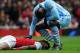 LONDON, ENGLAND - APRIL 08: Mario Balotelli of Man City apologises to Alex Song of Arsena during the Barclays Premier League match between Arsenal and Manchester City at Emirates Stadium on April 8, 2012 in London, England. (Photo by Michael Regan/Getty Images)