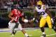 OXFORD, MS - NOVEMBER 19: Barry Brunetti #11 of the Ole Miss Rebels scrambles with the ball against Michael Brockers #90 of the LSU Tigers on November 19, 2011 at Vaught-Hemingway Stadium in Oxford, Mississippi. (Photo by Joe Murphy/Getty Images)