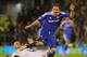 LONDON, ENGLAND - APRIL 09: Frank Lampard of Chelsea is tackled by Danny Murphy of Fulham during the Barclays Premier League match between Fulham and Chelsea at Craven Cottage on April 9, 2012 in London, England. (Photo by Mike Hewitt/Getty Images)