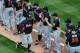 PHILADELPHIA, PA - APRIL 09: Manager Ozzie Guillen of the Miami Marlins greets his players before the Philadelphia Phillies home opener at Citizens Bank Park on April 9, 2012 in Philadelphia, Pennsylvania. (Photo by Drew Hallowell/Getty Images)