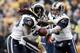 PITTSBURGH, PA - DECEMBER 24: Kellen Clemens #12 of the St. Louis Rams hands the ball off to teammate Steven Jackson #39 during the Christmas Eve game on December 24, 2011 at Heinz Field in Pittsburgh, Pennsylvania. (Photo by Jared Wickerham/Getty Images)