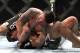 Frank Mir (top) attacks the arm of Antonio Rodrigo Nogueira at UFC 140 (Photo Credit: Tracy Lee/Yahoo! Sports).
