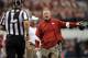 Former Arkansas coach Bobby Petrino verifies direction of nearest exit.