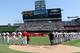ANAHEIM, CA - SEPTEMBER 11: Players line up during a pre-game ceremony recognizing the 10th anniversary of the September 11th attacks at Angel Stadium of Anaheim on September 11, 2011 in Anaheim, California. (Photo by Harry How/Getty Images)