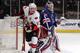Daniel Alfredsson (#11) and the Ottawa Senators are no match for Henrik Lundqvist's Rangers.