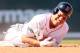 Jacoby Ellsbury grasps his shoulder in Friday's Red Sox game.