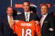 ENGLEWOOD, CO - MARCH 20: Quarterback Peyton Manning (C) poses with majority owner, president, and CEO Pat Bowlen (L) and executive vice president of football operations John Elway (R) during a news conference announcing Manning's contract with the Denver Broncos in the team meeting room at the Paul D. Bowlen Memorial Broncos Centre on March 20, 2012 in Englewood, Colorado. Manning, entering his 15th NFL season, was released by the Indianapolis Colts on March 7, 2012, where he had played his whole career. It has been reported that Manning will sign a five-year, $96 million offer. (Photo by Justin Edmonds/Getty Images)