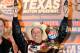 FORT WORTH, TX - APRIL 14: Greg Biffle, driver of the #16 Filtrete Ford, celebrates with the trophy in victory lane after winning the NASCAR Sprint Cup Series Samsung Mobile 500 at Texas Motor Speedway on April 14, 2012 in Fort Worth, Texas. (Photo by John Harrelson/Getty Images for NASCAR)