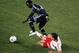 HARRISON, NJ - APRIL 14: Milovan Mirosevic #10 of the San Jose Earthquakes carries the ball against Rafa Marquez #4 of the New York Red Bulls at Red Bull Arena on April 14, 2012 in Harrison, New Jersey. (Photo by Mike Stobe/Getty Images for New York Red Bulls)