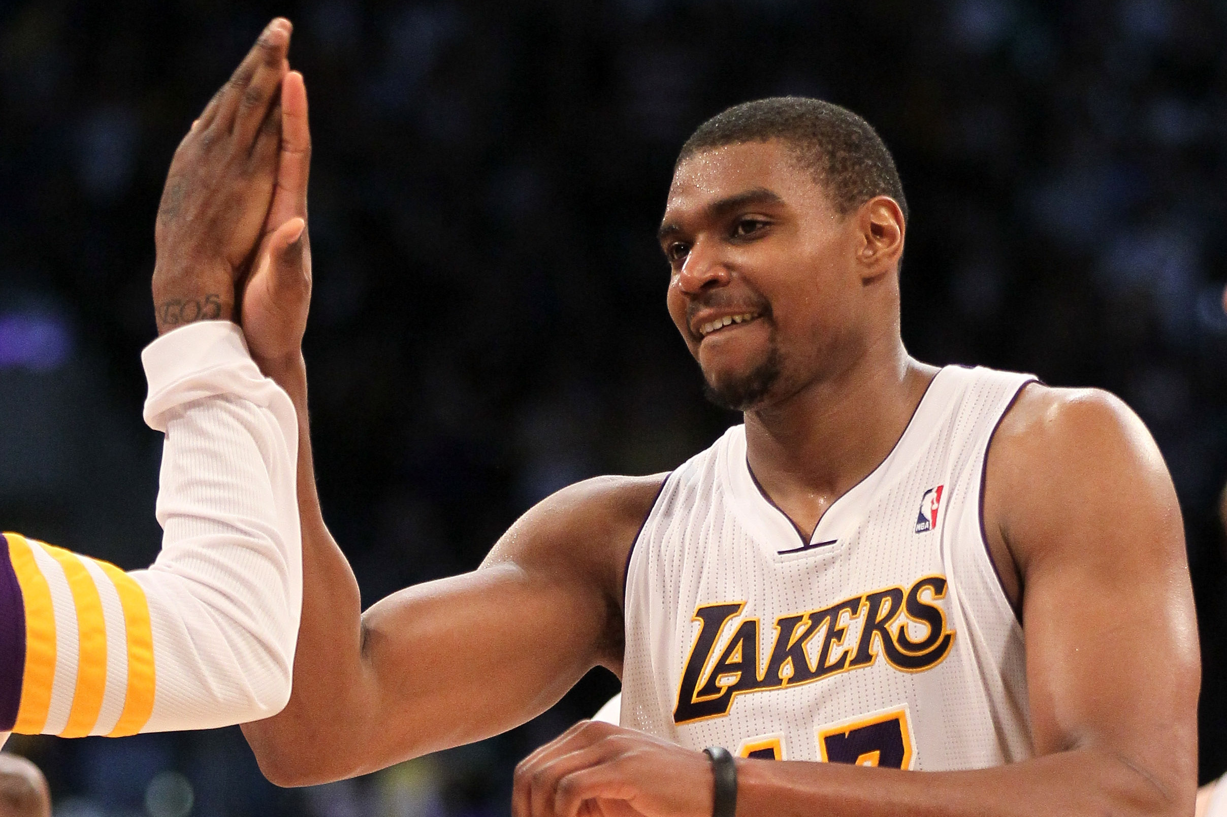 Andrew Bynum of the Los Angeles Lakers wears a knee brace as he