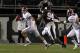 STARKVILLE, MS - NOVEMBER 12: quarterback AJ McCarron #10 of the Alabama Crimson Tide scrambles away from pressure from defensive lineman Fletcher Cox #94 of the Mississippi State Bulldogs on November 12, 2011 at Davis Wade Stadium in Starkville, Mississippi. Alabama won 24-7. (Photo by Butch Dill/Getty Images)