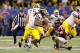 NEW ORLEANS, LA - JANUARY 03: Denard Robinson #16 of the Michigan Wolverines stiffarms Kyle Fuller #17 of the Virginia Tech Hokies during the Allstate Sugar Bowl at Mercedes-Benz Superdome on January 3, 2012 in New Orleans, Louisiana. (Photo by Kevin C. Cox/Getty Images)