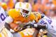 KNOXVILLE, TN - OCTOBER 15: Tauren Poole #28 of the Tennessee Volunteers tries to break a tackle by Tahj Jones #58 of the LSU Tigers at Neyland Stadium on October 15, 2011 in Knoxville, Tennessee. (Photo by Kevin C. Cox/Getty Images)