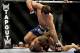 Apr 21, 2012; Atlanta, GA, USA; Rory MacDonald (top) fights Chad Mills in a welterweight bout during UFC 145 at Philips Arena. MacDonald won the bout by technical knockout. Paul Abell-US PRESSWIRE