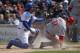 CHICAGO, IL - APRIL 22: Geovany Soto #18 of the Chicago Cubs shows the ball to the umpire after tagging out Jay Bruce #32 of the Cincinnati Reds on a squeeze play at Wrigley Field on April 22, 2012 in Chicago, Illinois. (Photo by Jonathan Daniel/Getty Images)