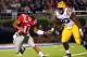OXFORD, MS - NOVEMBER 19: Barry Brunetti #11 of the Ole Miss Rebels scrambles with the ball against Michael Brockers #90 of the LSU Tigers on November 19, 2011 at Vaught-Hemingway Stadium in Oxford, Mississippi. (Photo by Joe Murphy/Getty Images)