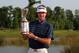 NEW ORLEANS, LA - MAY 1: Bubba Watson smiles with the trophy after winning the final round of the Zurich Classic at the TPC Louisiana on May 1, 2011 in New Orleans, Louisiana. (Photo by Hunter Martin/Getty Images)