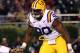 OXFORD, MS - NOVEMBER 19: Barry Brunetti #11 of the Ole Miss Rebels scrambles with the ball against Michael Brockers #90 of the LSU Tigers on November 19, 2011 at Vaught-Hemingway Stadium in Oxford, Mississippi. (Photo by Joe Murphy/Getty Images)
