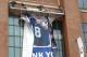 The banner of Peyton Manning outside Lucas Oil Stadium came down yesterday (Alex Campell, Indianapolis Star)