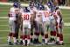 INDIANAPOLIS, IN - FEBRUARY 05: Eli Manning #10 of the New York Giants calls a play in the huddle against the New England Patriots during Super Bowl XLVI at Lucas Oil Stadium on February 5, 2012 in Indianapolis, Indiana. (Photo by Jeff Gross/Getty Images)