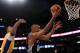 LOS ANGELES, CA - APRIL 17: Tim Duncan #21 of the San Antonio Spurs scores on a layup past Ramon Sessions #7 of the Los Angeles Lakers during a 112-91 Spurs win at Staples Center on April 17, 2012 in Los Angeles, California. NOTE TO USER: User expressly acknowledges and agrees that, by downloading and or using this photograph, User is consenting to the terms and conditions of the Getty Images License Agreement. (Photo by Harry How/Getty Images)