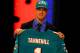 NEW YORK, NY - APRIL 26: Ryan Tannehill from Texas A&M holds up a jersey as he stands on stage after he was selected #8 overall by the Miami Dolphins in the first round of during the 2012 NFL Draft at Radio City Music Hall on April 26, 2012 in New York City. (Photo by Al Bello/Getty Images)