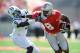 COLUMBUS, OH - SEPTEMBER 18: DeVier Posey #8 of the Ohio State Buckeyes stiff arms his brother Julian Posey #9 of the Ohio Bobcats at Ohio Stadium on September 18, 2010 in Columbus, Ohio. (Photo by Jamie Sabau/Getty Images)