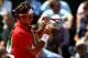 PARIS, FRANCE - JUNE 05: Roger Federer of Switzerland checks his racquet during the men's singles final match between Rafael Nadal of Spain and Roger Federer of Switzerland on day fifteen of the French Open at Roland Garros on June 5, 2011 in Paris, France. (Photo by Clive Brunskill/Getty Images)