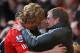 LIVERPOOL, ENGLAND - JANUARY 28: Liverpool Manager Kenny Dalglish embraces Dirk Kuyt at the end of the FA Cup Fourth Round match between Liverpool and Manchester United at Anfield on January 28, 2012 in Liverpool, England. (Photo by Alex Livesey/Getty Images)