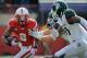 LINCOLN, NE - OCTOBER 29: Running back Aaron Green #2 of the Nebraska Cornhuskers runs through the Michigan State Spartans defense during their game against the Michigan State Spartans defense at Memorial Stadium October 29, 2011 in Lincoln, Nebraska. Nebraska defeated Michigan State 24-3. (Photo by Eric Francis/Getty Images)
