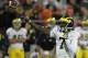 CHAMPAIGN, IL - NOVEMBER 12: Devin Gardner #7 of the Michigan Wolverines throws a touchdown pass against the Illinois Fighting Illini at Memorial Stadium on November 12, 2011 in Champaign, Illinois. Michigan defeated Illinois 31-14. (Photo by Jonathan Daniel/Getty Images)