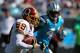 CHARLOTTE, NC - OCTOBER 23: Santana Moss #89 of the Washington Redskins runs past Captain Munnerlyn #41 of the Carolina Panthers during their game at Bank of America Stadium on October 23, 2011 in Charlotte, North Carolina. (Photo by Scott Halleran/Getty Images)