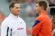 Auburn head coach Gene Chizik (left) with Clemson head coach Dabo Swinney