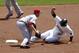 PITTSBURGH, PA - MAY 6: Zack Cozart #2 of the Cincinnati Reds tags out Jose Tabata #31 of the Pittsburgh Pirates during the game on May 6, 2012 at PNC Park in Pittsburgh, Pennsylvania. (Photo by Justin K. Aller/Getty Images)